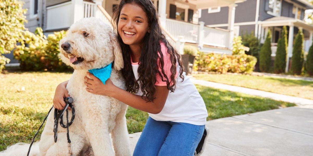 portrait-of-girl-with-dog-on-suburban-street-2021-08-26-16-13-38-utc-min.jpg